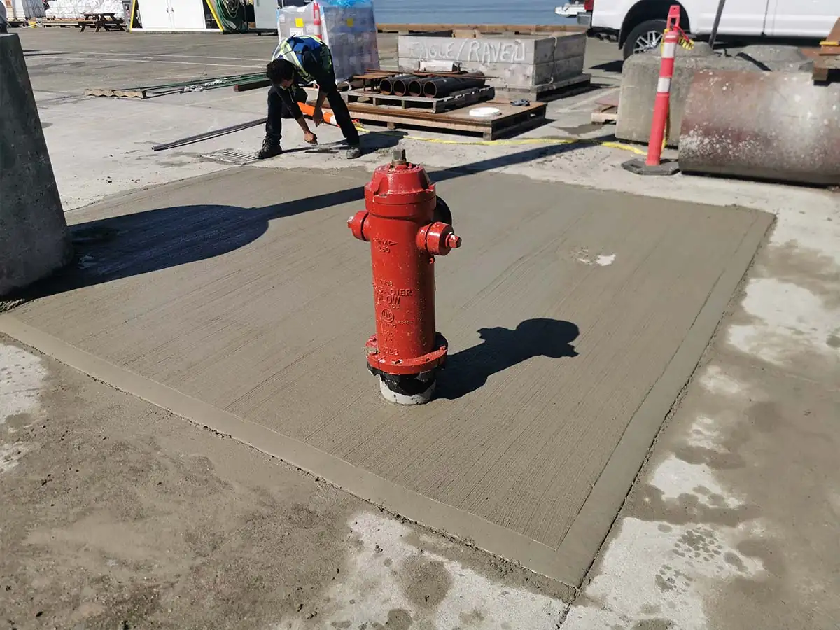 New concrete pad around a fire hydrant