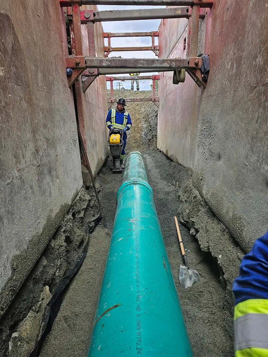 New sewer pipe bedded in the trench