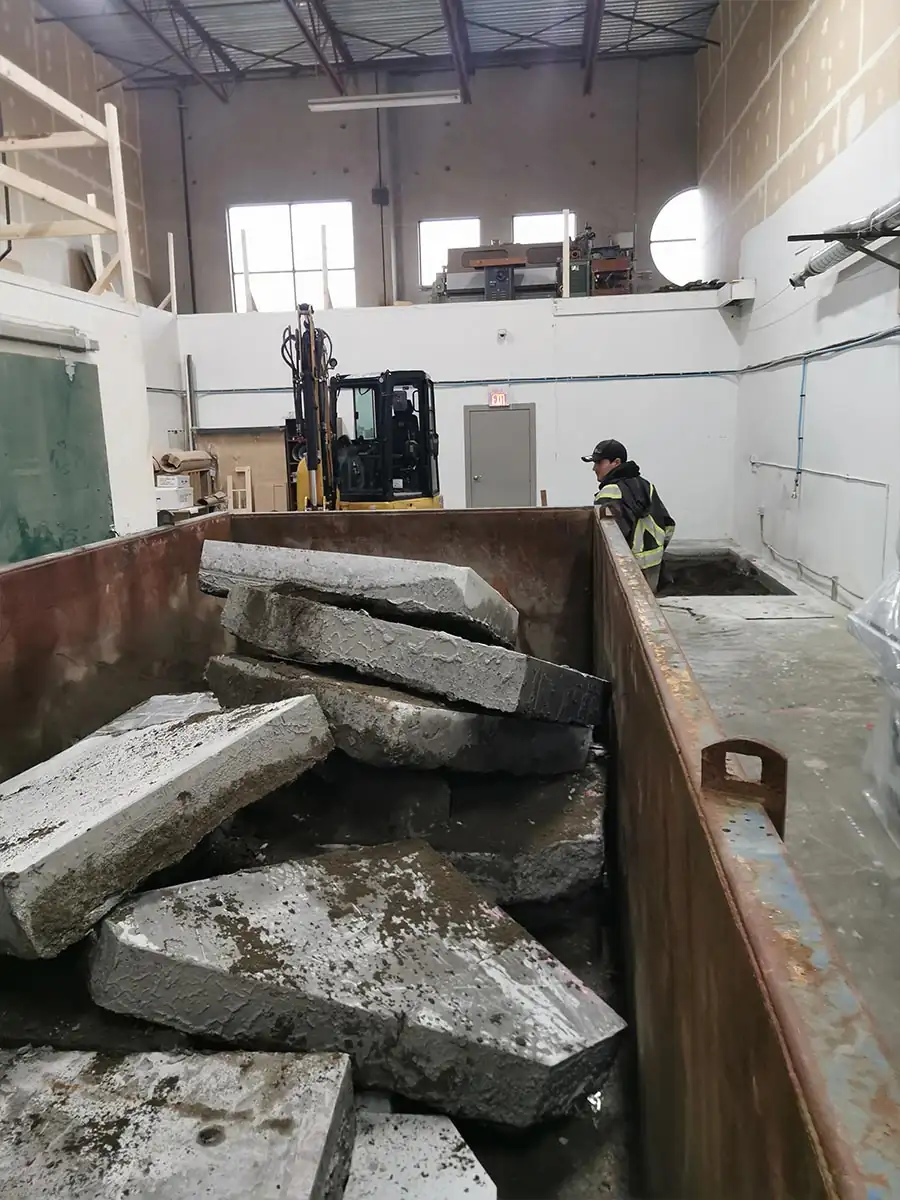 Broken concrete loaded into a bin